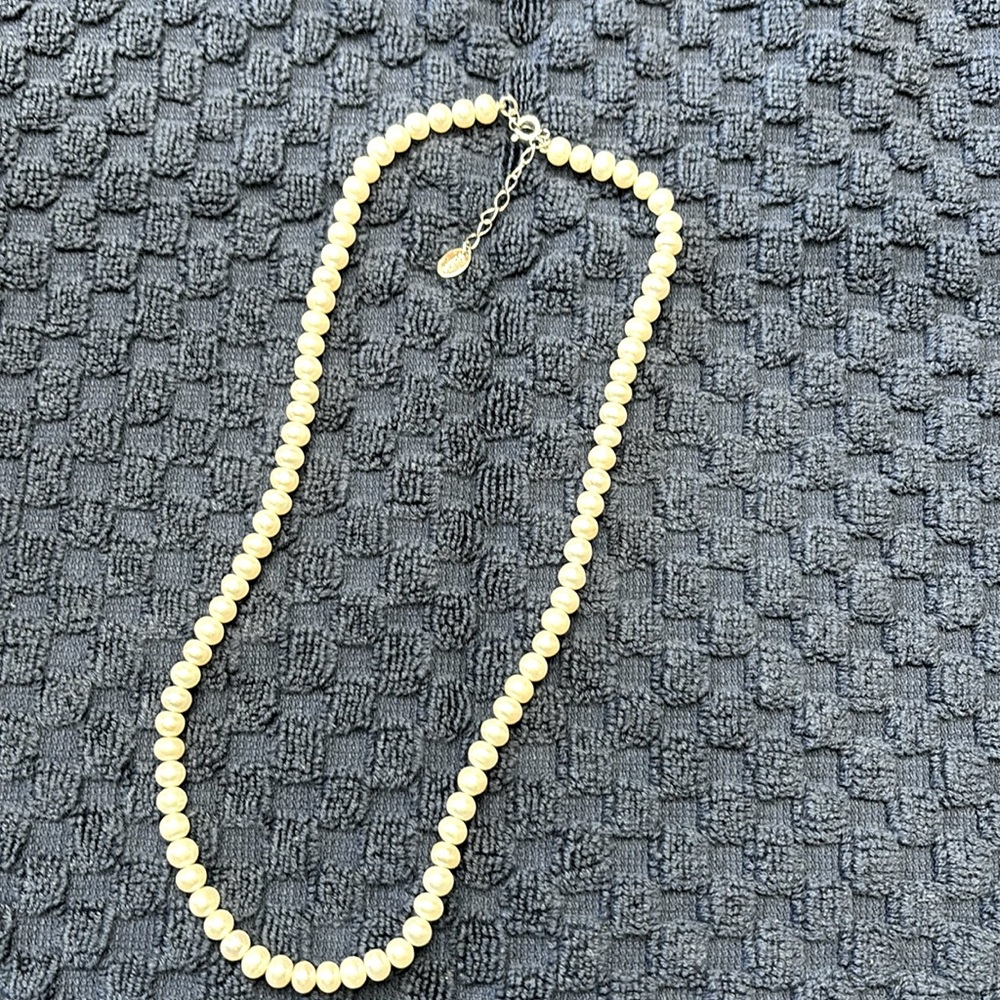 Genuine pearls necklace with sterling silver clasp.